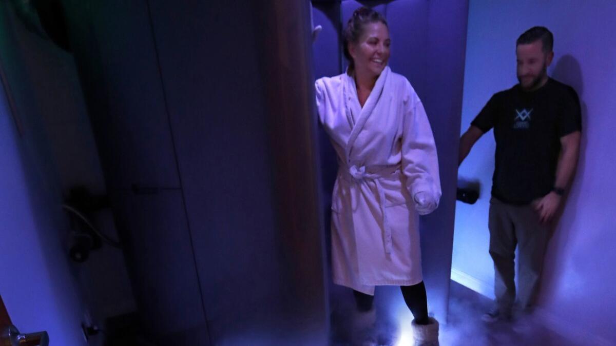 Nitrogen vapor fills the room as customer Lani Cooper, 38, opens the door after completing a whole-body cryotherapy session at Coast Cryo in Venice in March.