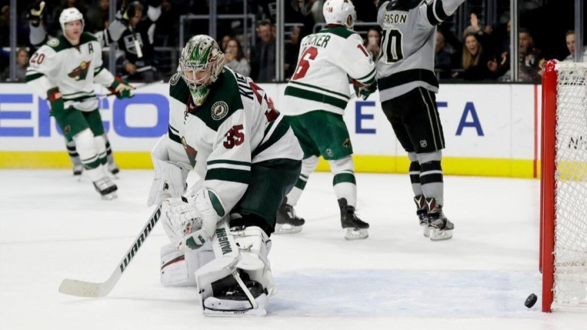 Minnesota Wild goaltender Darcy Kuemper reacts moments after Kings winger Tanner Pearson scored an overtime goal at Staples Center on Saturday.