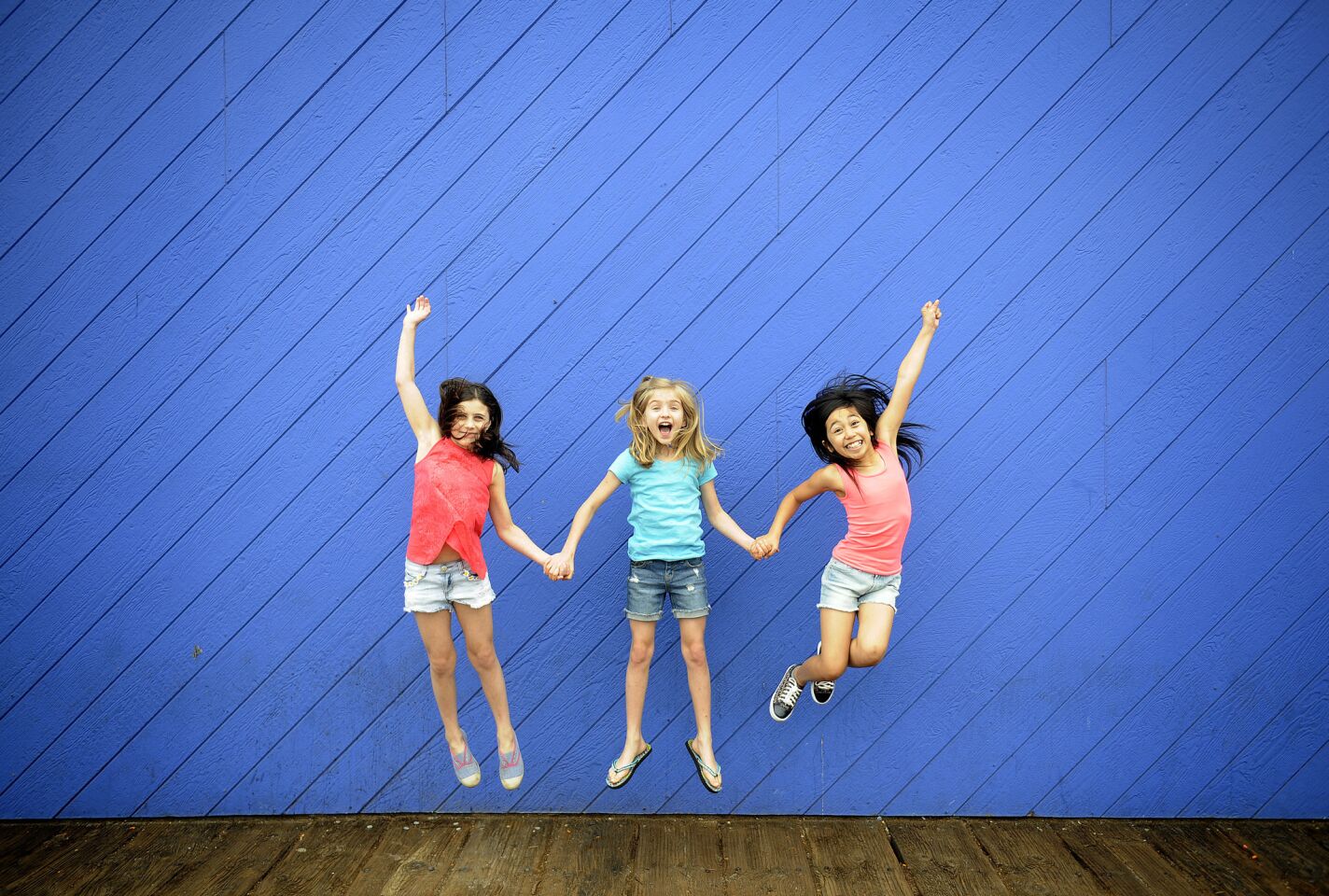 Mia Sinclair Jenness, left, Mabel Tyler and Gabby Gutierrez alternate playing the title role in the musical adaptation of Roald Dahl's "Matilda" at the Ahmanson Theatre. The three are shown during a day at Santa Monica Pier on June 16, 2015.