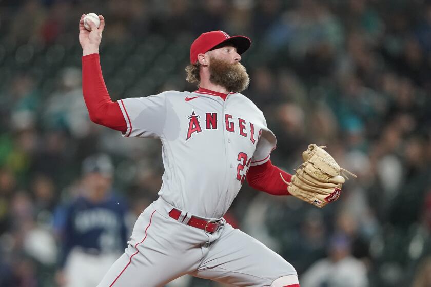 Los Angeles Angels closing pitcher Archie Bradley throws against the Seattle Mariners.
