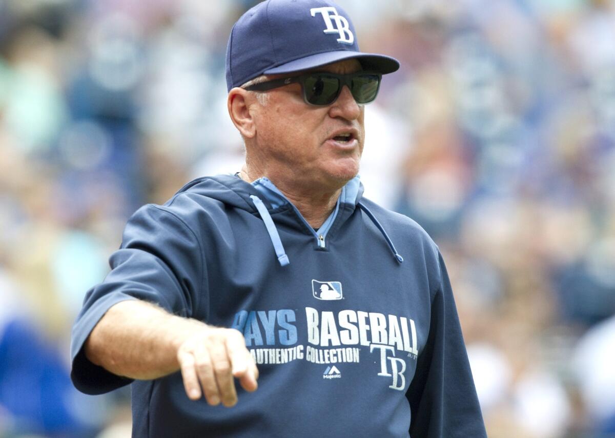 Tampa Bay Manager Joe Maddon argues with umpire Bob Davidson after a call at first base was reviewed and overturned during a game against the Blue Jays on Saturday.