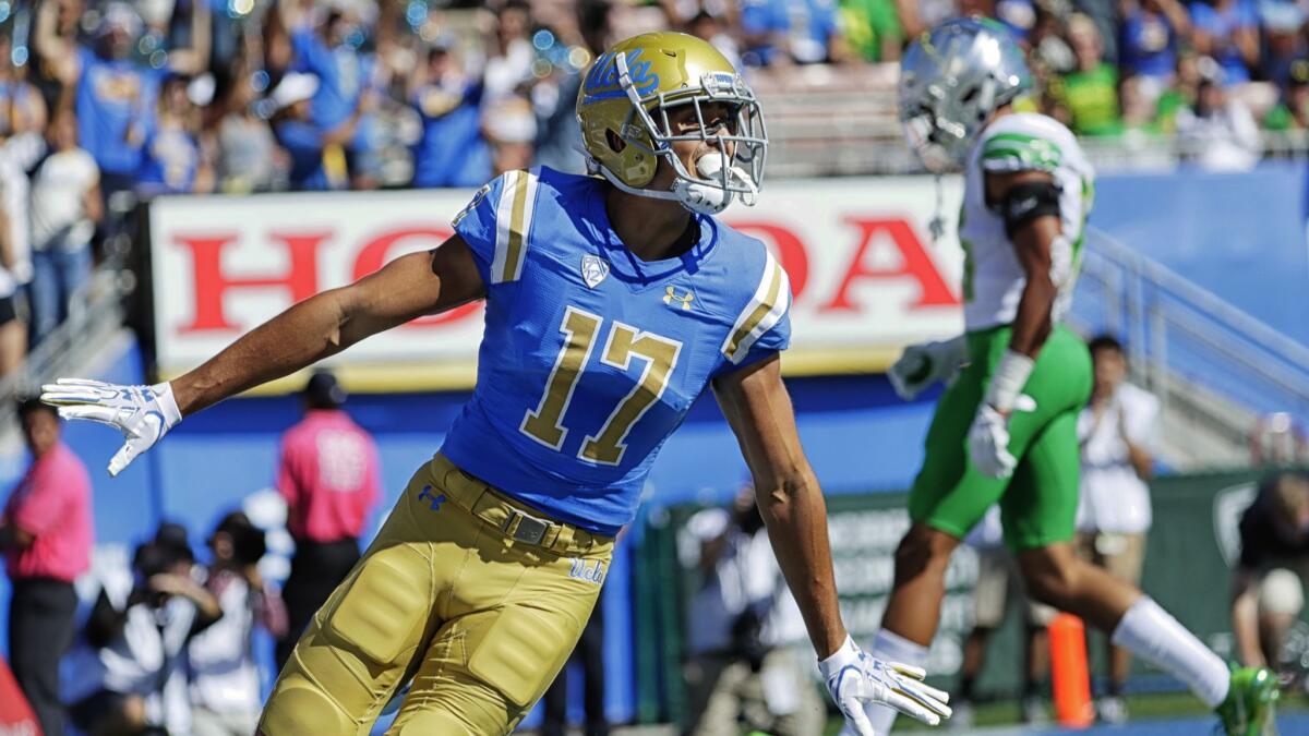 Christian Pabico celebrates in the end zone after scoring a touchdown against Oregon on Oct. 21, 2017.