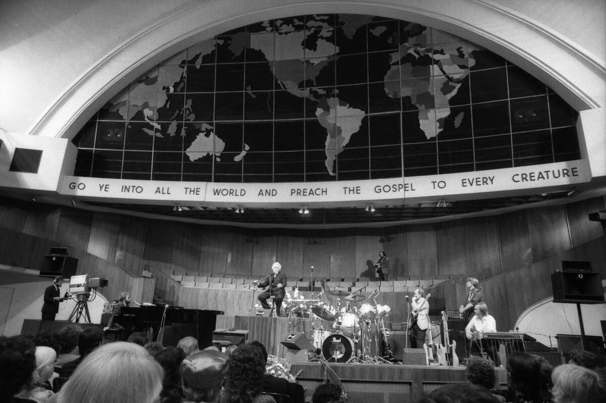 July 6, 1986: Dr. Gene Scott on stage of Church of the Open Door in Los Angeles.