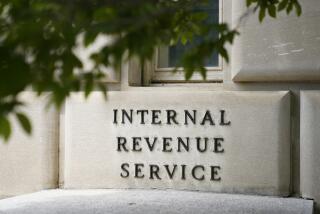 FILE - A sign outside the Internal Revenue Service building in Washington, on May 4, 2021. Most taxpayers will be able to digitally submit a slew of tax documents and other communications to the IRS next filing season and the agency plans to go completely paperless in 2025. (AP Photo/Patrick Semansky, File)