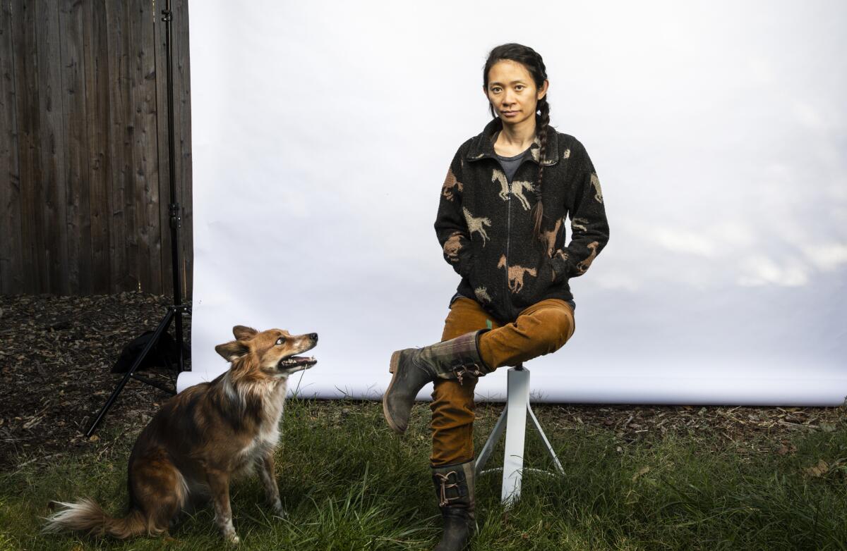 Director Chloé Zhao with canine friend in the backyard of her home outside Los Angeles.