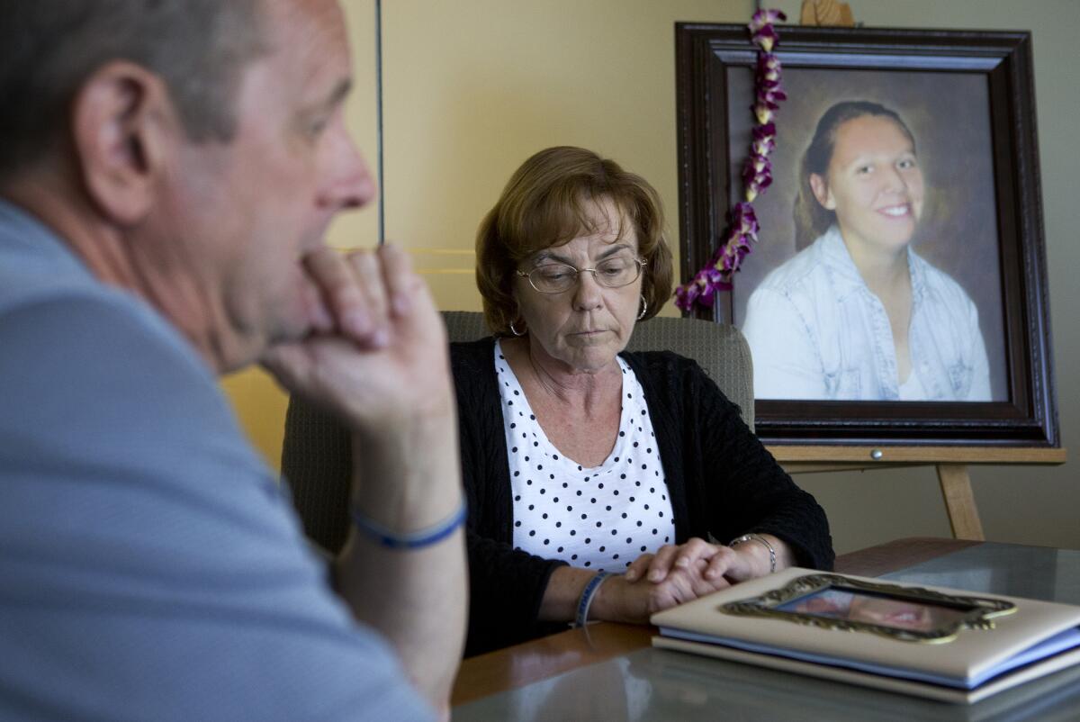 Jim Showman, left, and Vickie Showman, right, react as they speak to this paper about the Aug. 14 San Jose Police Department officer-involved shooting of their daughter Diana Showman, at the law offices of Steven Clark in San Jose, Calif., on Tuesday, Aug. 26, 2014. (LiPo Ching/Bay Area News Group)
