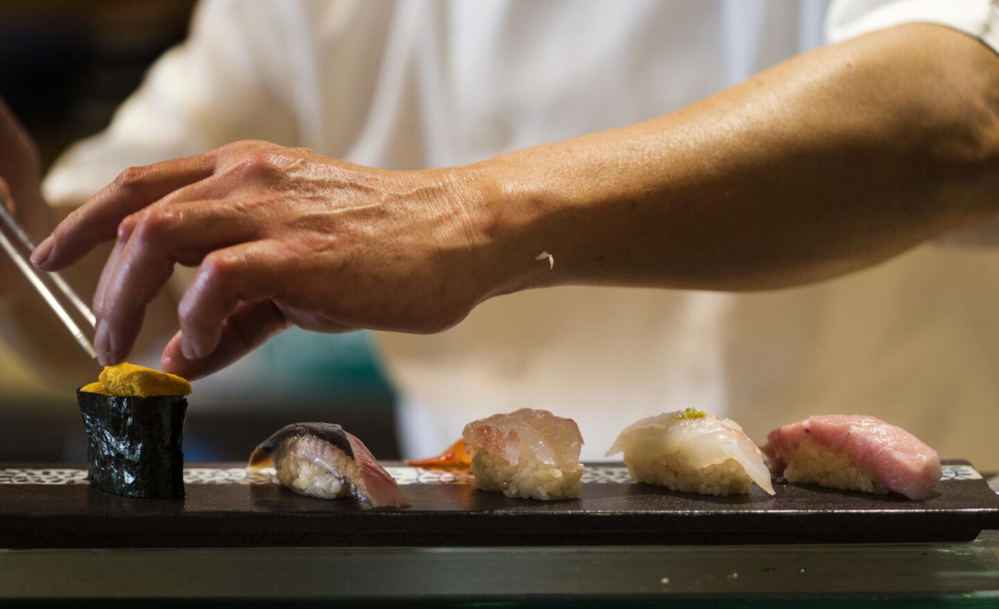 Chef Yutaka Kudo prepares the chef's special sushi plate at Osawa in Pasadena.