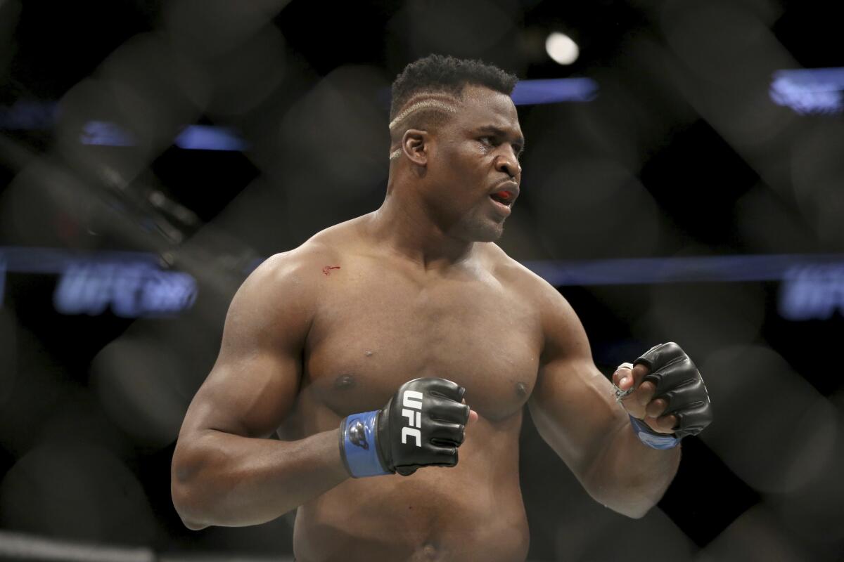 Francis Ngannou faces Stipe Miocic during a heavyweight championship bout 