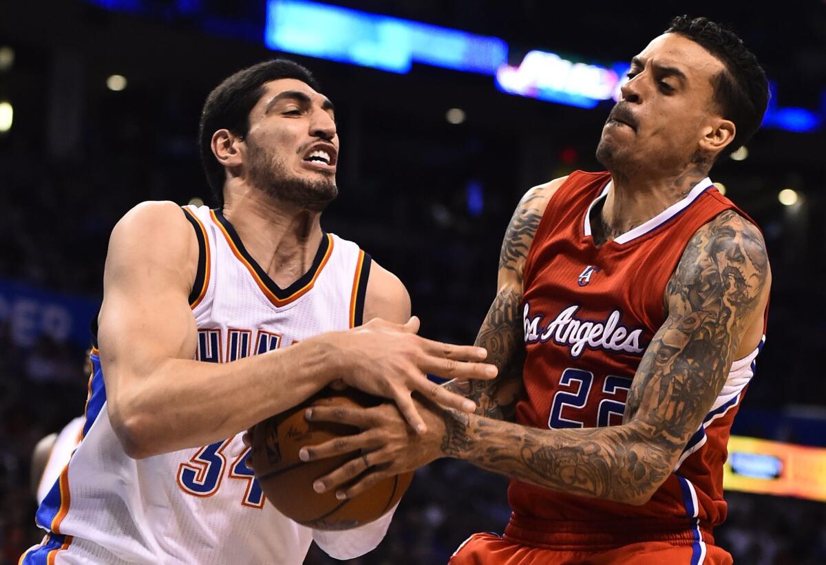 Matt Barnes, right, fights for the ball with Oklahoma City's Enes Kanter on Wednesday night.