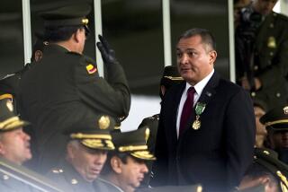 Mexican Secretary of Public Safety Genaro Garcia Luna (R) attends the celebration ceremony of the 71st anniversary of the Police Cadet school General Santander, in Bogota, Colombia on May 19, 2011. AFP PHOTO/LUIS ACOSTA (Photo credit should read LUIS ACOSTA/AFP via Getty Images)