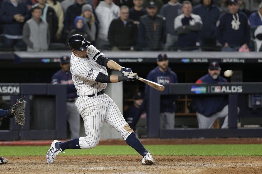 The Yankees' DJ LeMahieu hits a three-run double during Game 1 of the ALDS on Oct. 4, 2019.