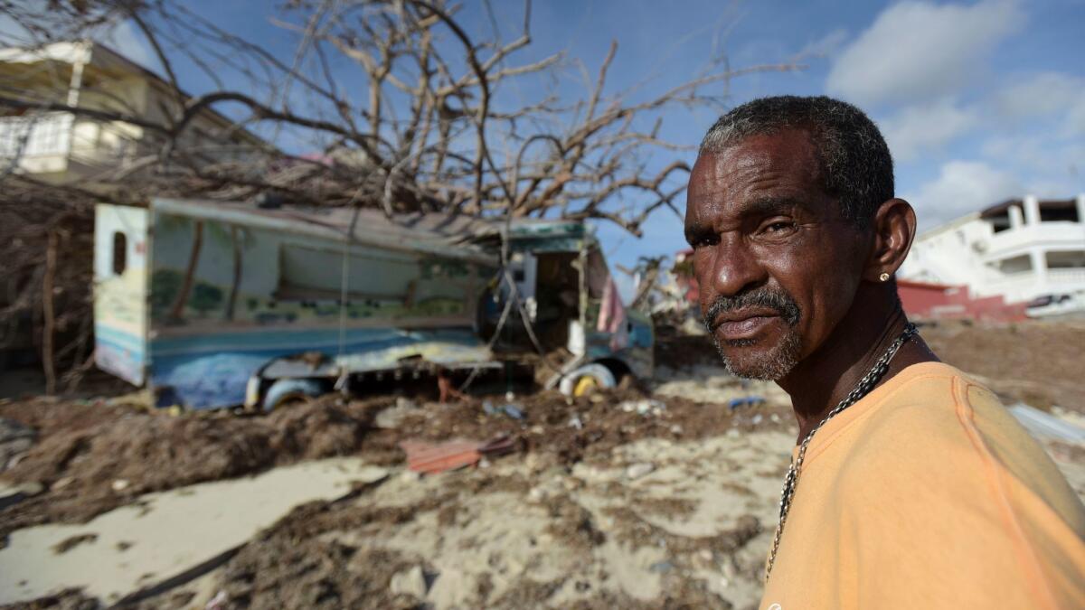On Monday, Sept. 11, 2017, Juan Antonio Higuey shows his destroyed home at Cold Bay community after the passage of Hurricane Irma in St. Martin.