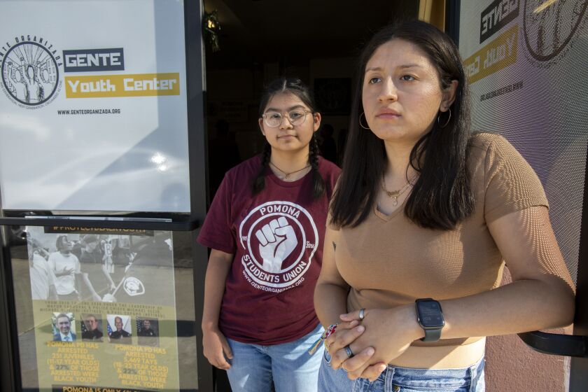 POMONA, CA - JULY 1, 2021: High school Caroline Lucas, 16, left, and college student Brenda Gomez, 21, were part of a grassroots group with Gente Organizada to remove school police from high school campuses on July 1, 2021 in Pomona, CA.(Gina Ferazzi / Los Angeles Times)