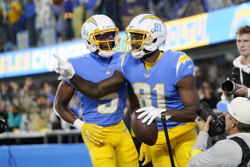 Chargers receiver Mike Williams (right) celebrates his touchdown catch with  Joshua Palmer.