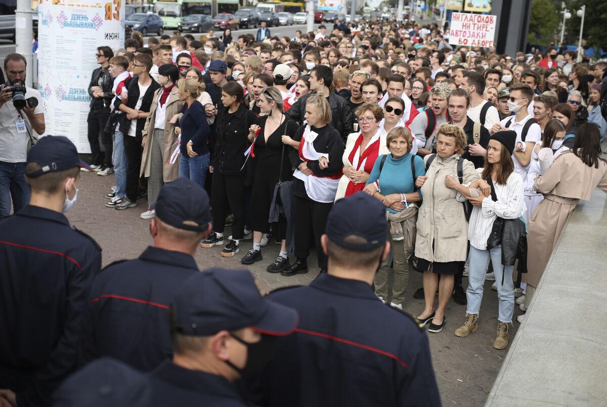 Belarusians attend a rally in Minsk, Belarus, Tuesday, Sept. 1, 2020. Several hundred students on Tuesday gathered in Minsk and marched through the city center, demanding the resignation of the country's authoritarian leader after an election the opposition denounced as rigged. Many have been detained as police moved to break up the crowds. (Tut.By via AP)