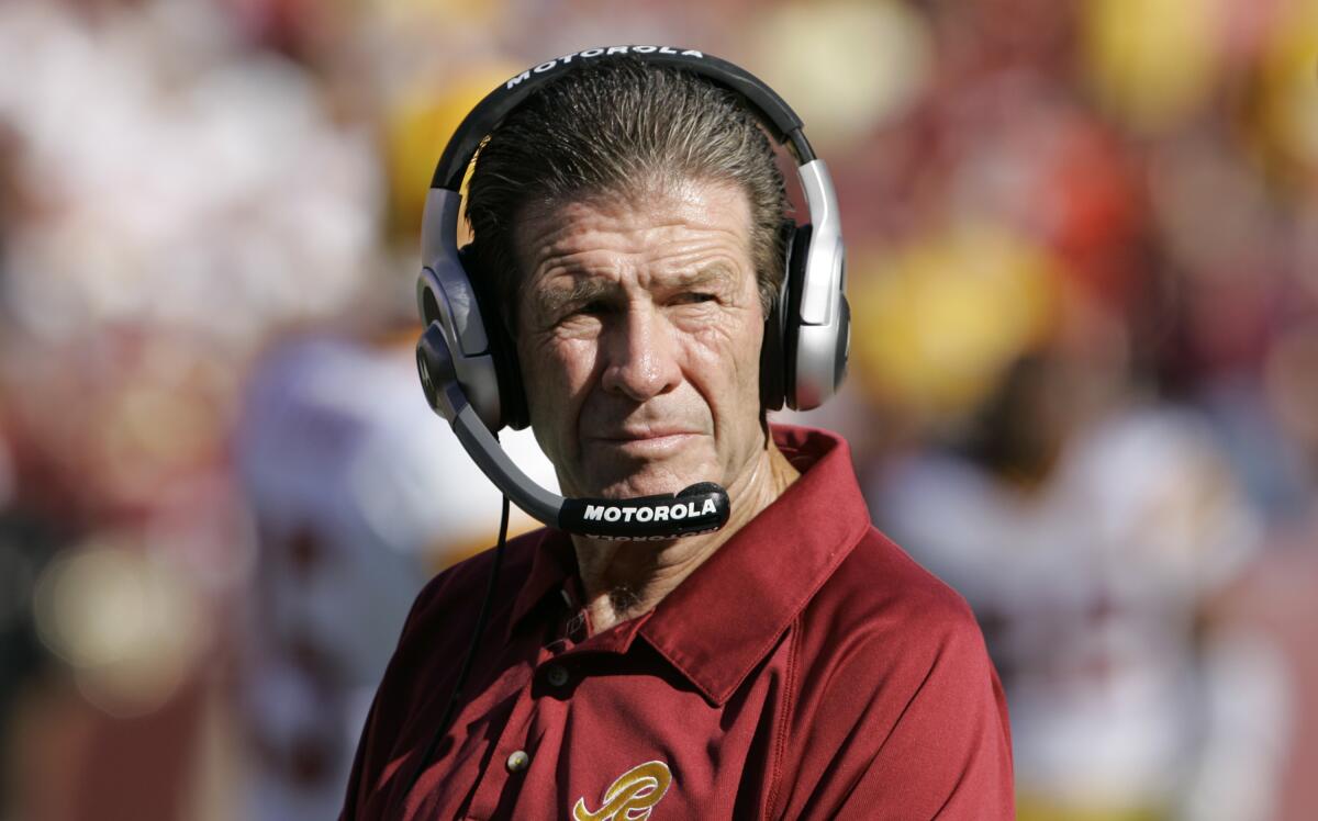 Washington Redskins offensive line coach Joe Bugel watches from the sidelines in 2007.