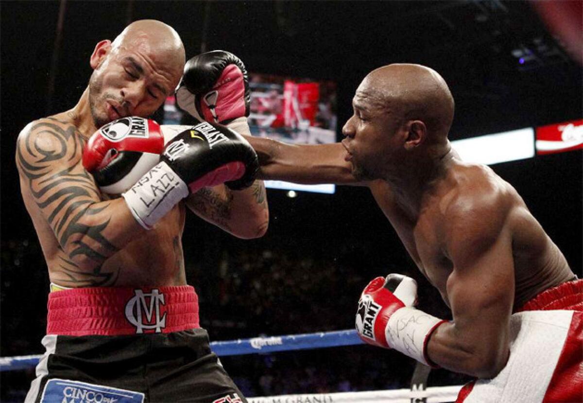 Floyd Mayweather Jr., right, last fought on May 5, defeating Miguel Cotto by unanimous decision.