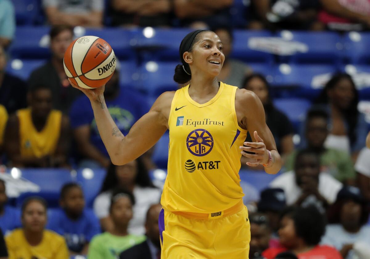 Sparks' Candace Parker makes a pass during a game against the Dallas Wings.