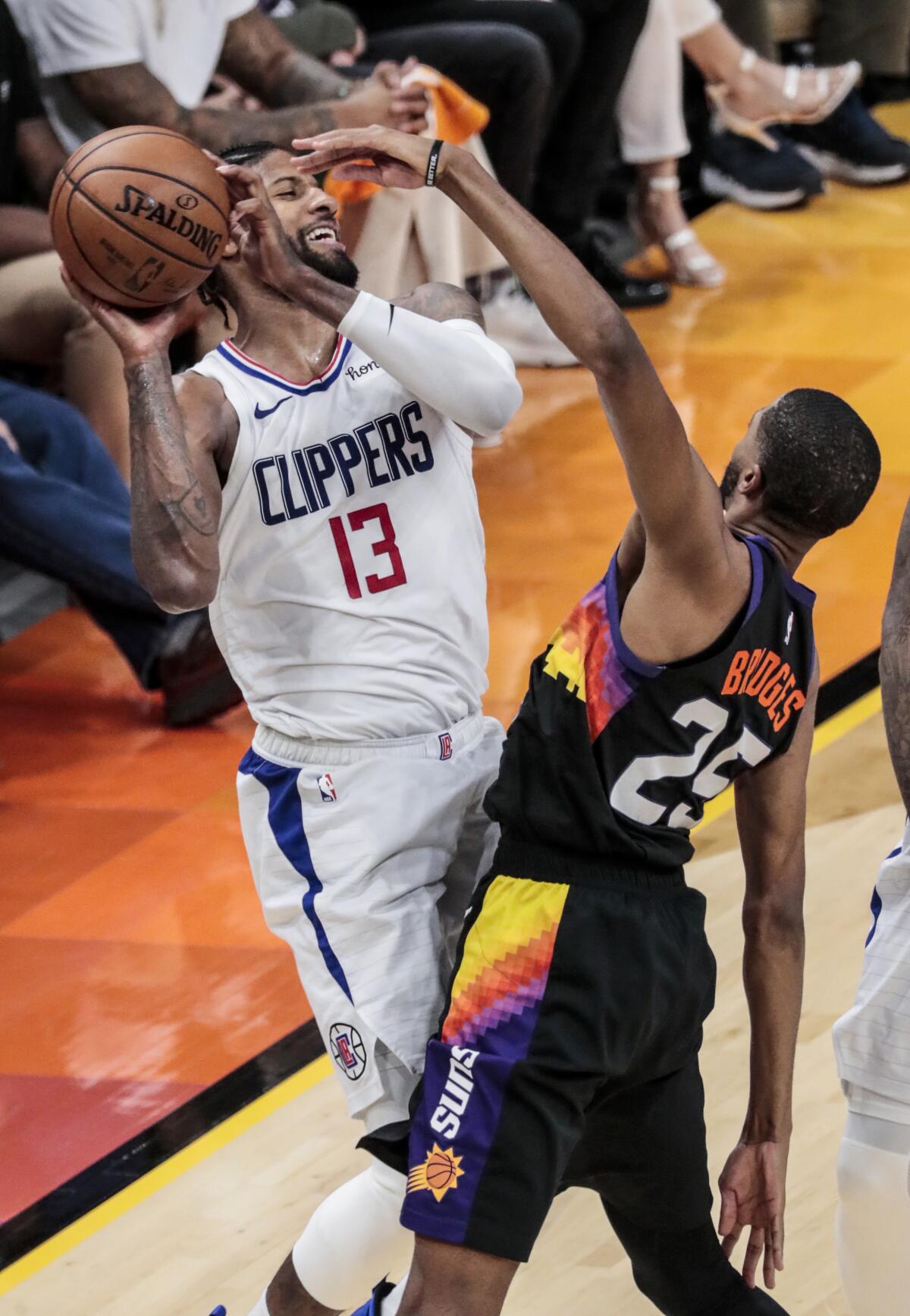 Clippers forward Paul George is pressured by Suns forward Mikal Bridges during Game 1.