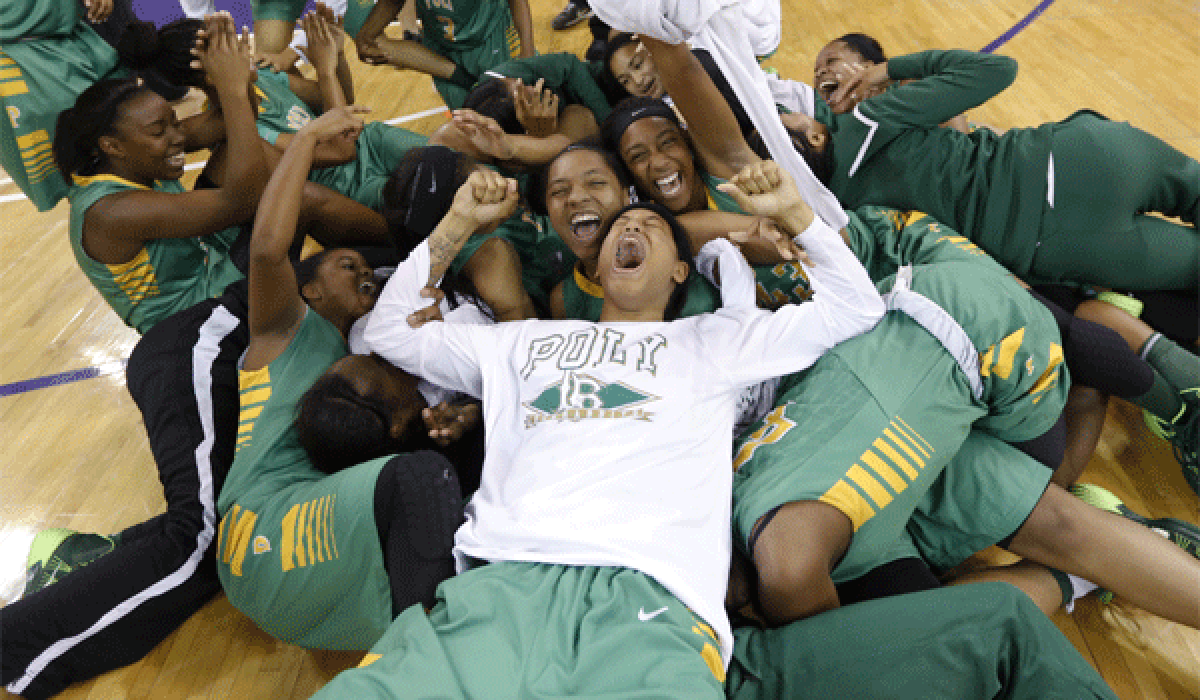 The Long Beach Poly players celebrate their sixth state championship and first in the Open Division, a 70-52 triumph over Richmond Salesian on Saturday night at Sleep Train Arena in Sacramento.