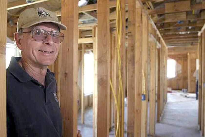 NEW MISSION: Elden Sandy of Camarillo is ending nine years of building houses for Habitat for Humanity in Ventura County to go with his wife to Papua New Guinea to teach the children of missionaries. He has helped in the building of 31 Habitat homes. The former Navy base engineer had no construction experience when he started.