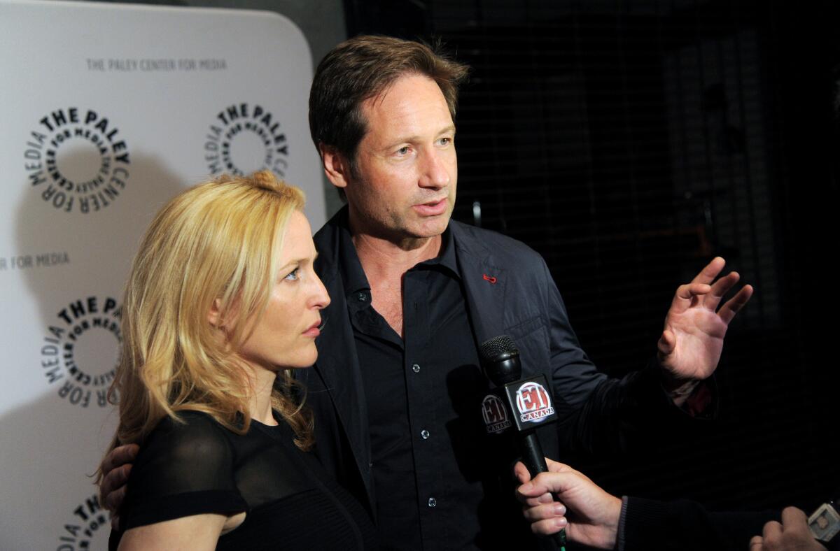 Gillian Anderson and David Duchovny attend "The Truth Is Here: David Duchovny and Gillian Anderson on 'The X-Files'" at the Paley Center for Media in New York.