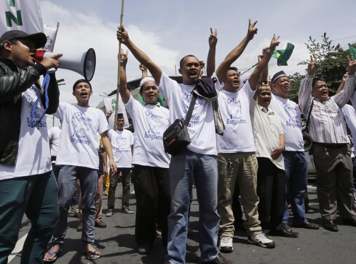 Filipino Muslims rally in Manila on Wednesday in support of a bill to grant autonomy to a Muslim region in the south, to be called Bangsamoro, or Moro Nation.
