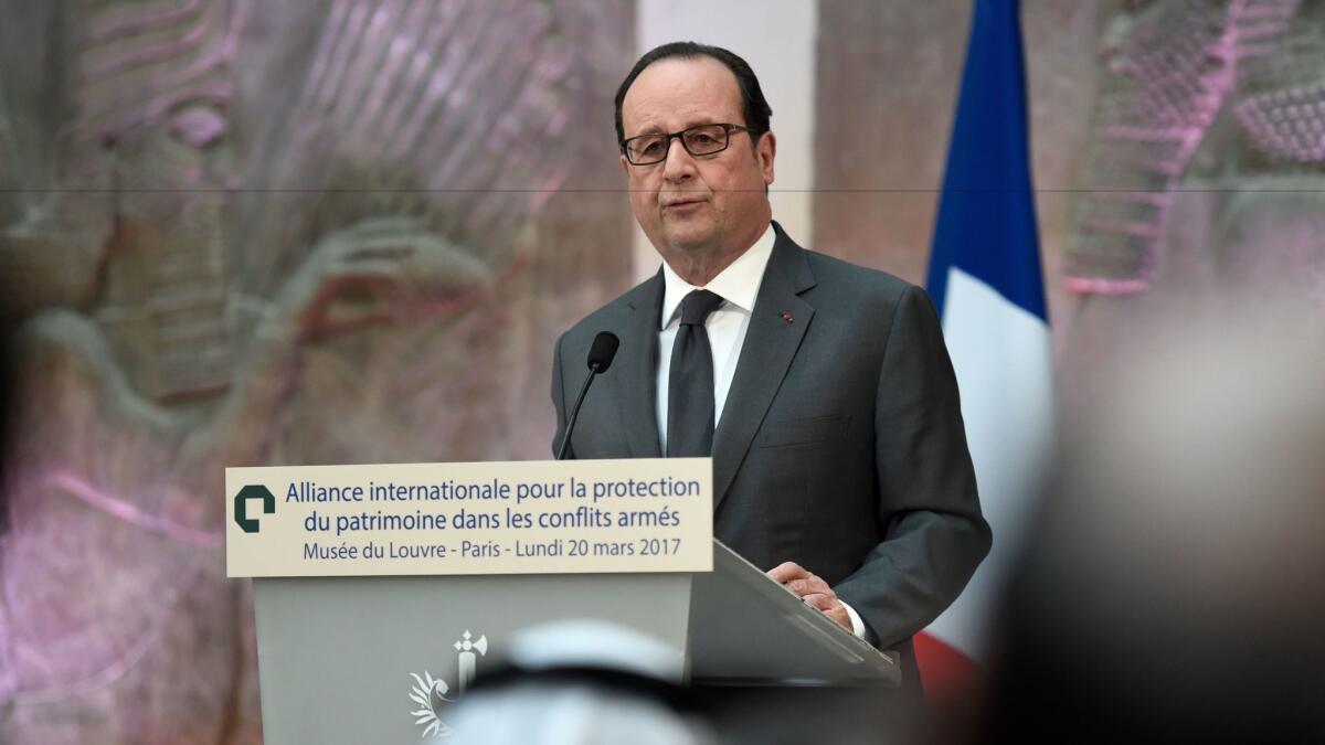 French President Francois Hollande speaks at the International Donors' Conference for the Protection of Heritage in Armed Conflict at the Louvre Museum in Paris on Monday.