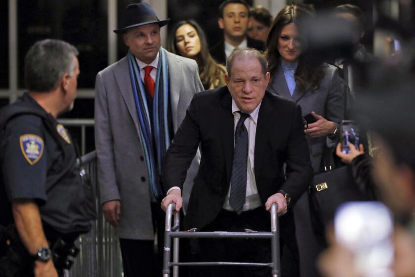 Harvey Weinstein leaves court in his rape trial, in New York, Wednesday, Jan. 22, 2020. Two of his attorneys, Arthur Aidala, and Donna Rotunno, are background left and background right. (AP Photo/Richard Drew)