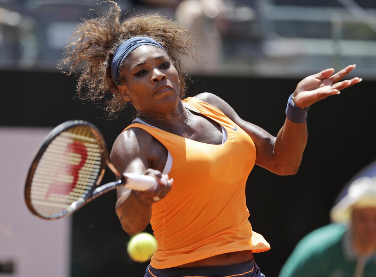 Serena Williams returns a shot against Simona Halep in the semifinals of the Italian Open.