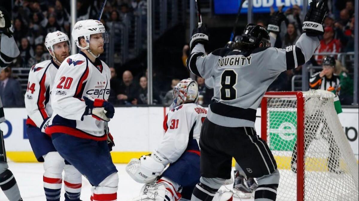 Defenseman Drew Doughty (8) celebrates in front of Capitals goaltender Philipp Grubauer after the Kings scored a goal during the second period of a game on March 11.