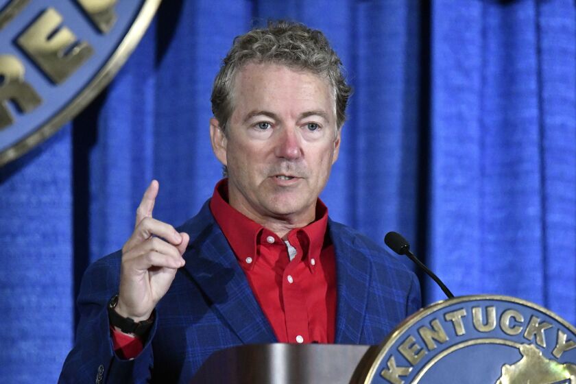 FILE - Republican Sen. Rand Paul, of Ky., addresses the audience at the Kentucky Farm Bureau Ham Breakfast at the Kentucky State Fair in Louisville, Ky., Aug. 25, 2022. Paul was the victim of a 2017 attack when his neighbor slammed into him outside his Kentucky home. Earlier that year, Paul took cover when a gunman opened fire while GOP members of Congress practiced for a charity baseball game. Now, Paul has falsely conflated those events with his opponent, Democrat Charles Booker, in his re-election bid. (AP Photo/Timothy D. Easley, File)