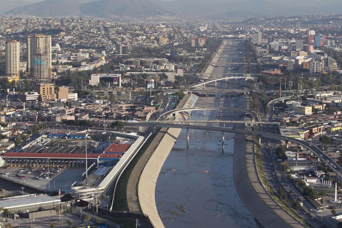 The Tijuana river flows to the U.S. just past the curve on the bottom of the photo.