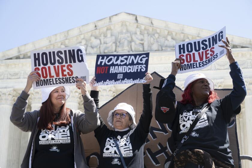 IMAGE DISTRIBUTED FOR NATIONAL HOMELESSNESS LAW CENTER - Homeless advocates take part in the "Housing Not Handcuffs" rally organized by the National Homelessness Law Center during Johnson v Grants Pass oral arguments at the Supreme Court on Monday, April 22, 2024 in Washington. (Kevin Wolf/AP Images for National Homelessness Law Center)