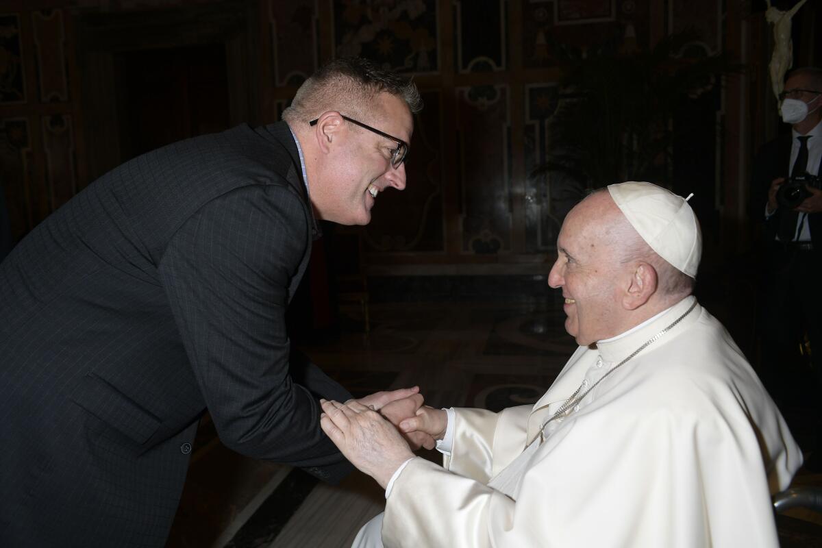 Aaron Bianco, a professor at the University of San Diego, meets Pope Francis at the Vatican.