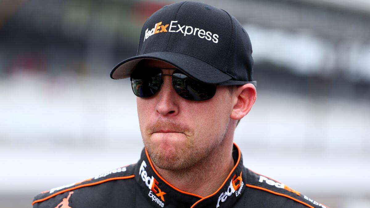 NASCAR Sprint Cup Series driver Denny Hamlin was fined and docked 75 championship points for having unapproved modifications on his car during Sunday's Brickyard 400.