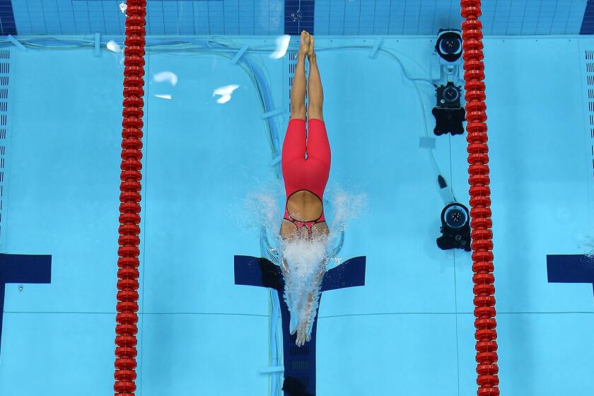 From left, Rikke Pedersen of Denmark, Rebecca Soni of the United States and Satomi Suzuki of Japan compete in the women's 200m breaststroke final.