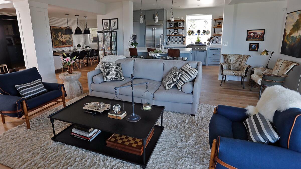 The living room, kitchen and dining room of Liz Torelli's home in Corona del Mar.