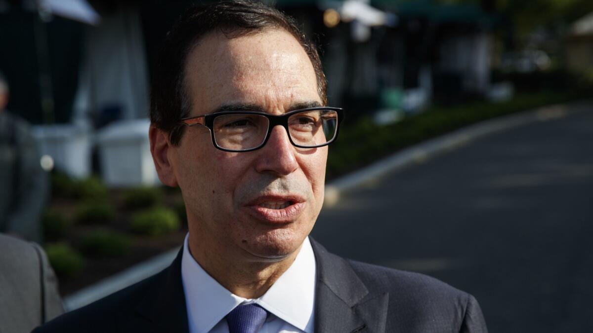 Treasury Secretary Steve Mnuchin talks with reporters about trade with China outside of the White House on May 21.