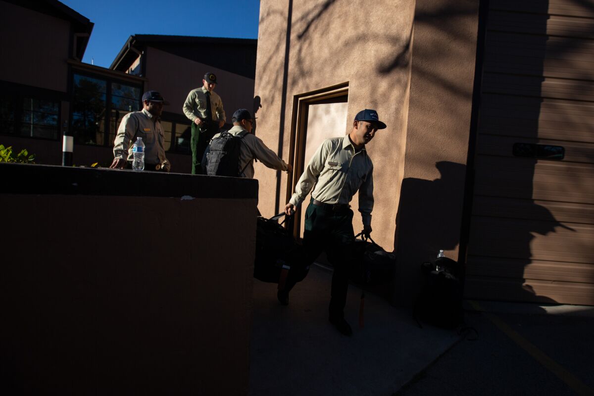 Sergio Tosano, 31, unpacks his car as he prepare to head to Melbourne, Australia.