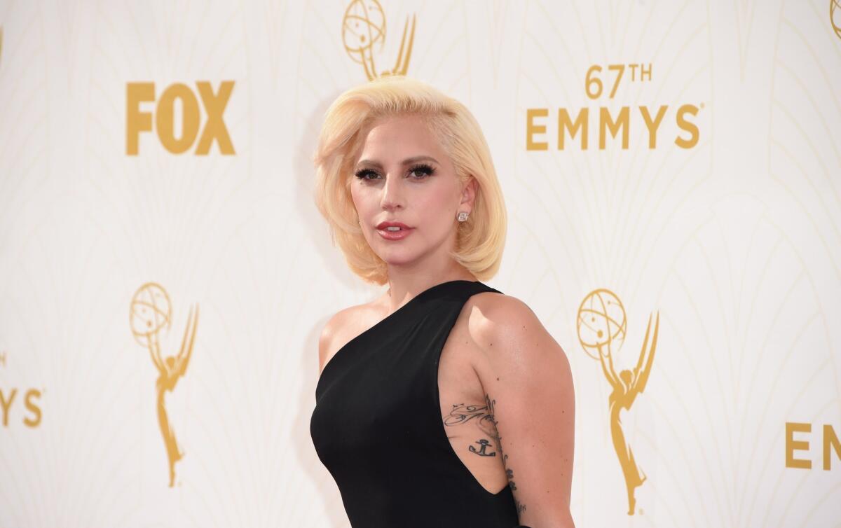 Lady Gaga channels understated glamour on the red carpet at the Emmy Awards.