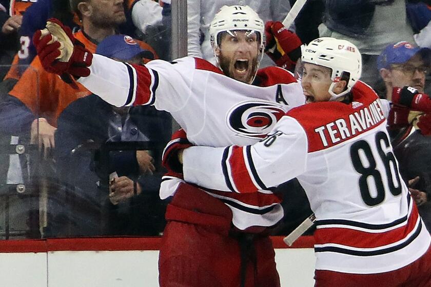 NEW YORK, NEW YORK - APRIL 26: Jordan Staal #11 of the Carolina Hurricanes scores at 4:04 of overtime against the New York Islanders and is joined by Teuvo Teravainen #86 in Game One of the Eastern Conference Second Round during the 2019 NHL Stanley Cup Playoffs at the Barclays Center on April 26, 2019 in the Brooklyn borough of New York City. The Hurricanes defeated the islanders 1-0 in overtime.(Photo by Bruce Bennett/Getty Images) ** OUTS - ELSENT, FPG, CM - OUTS * NM, PH, VA if sourced by CT, LA or MoD **