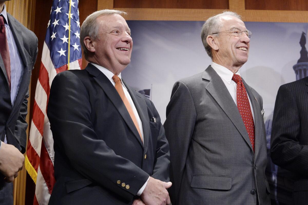 Democratic Senator Dick Durbin (left) and Republican Senator Chuck Grassley attend a news conference held to discuss the 'Sentencing Reform and Corrections Act of 2015' on Capitol Hill on Oct. 1.