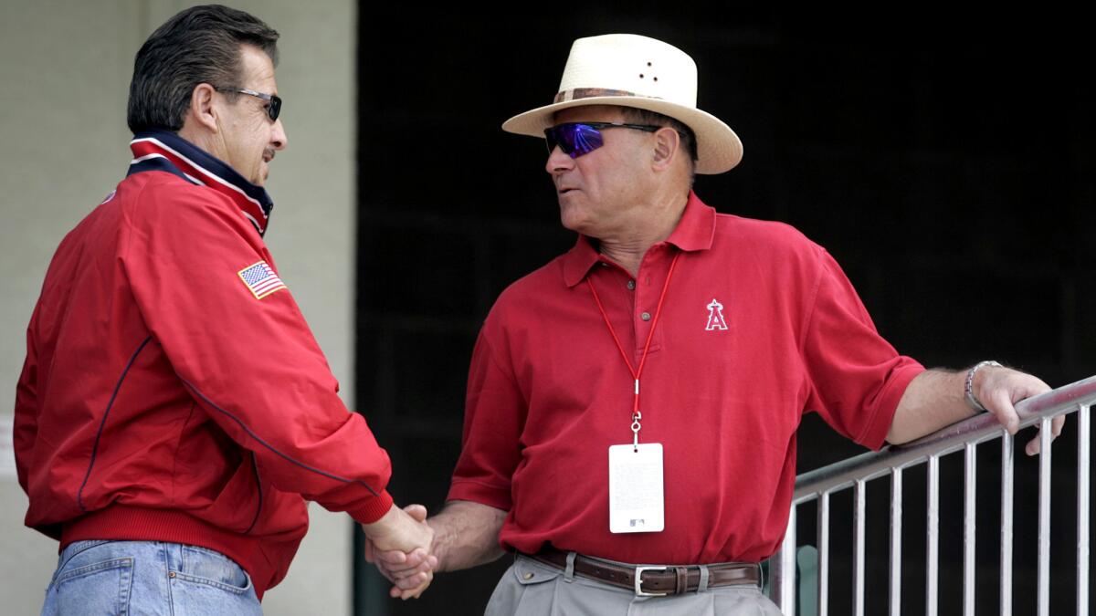 Angels owner Arte Moreno greets General Manager Bill Stoneman at a spring training workout in 2006. Moreno has made Stoneman the interim GM after the resignation of Jerry Dipoto.
