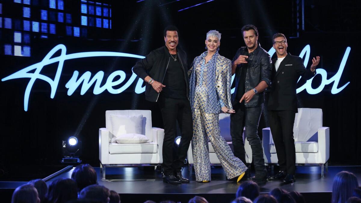 Lionel Richie, from left, Katy Perry and Luke Bryan are the new judges for "American Idol," along with host Ryan Seacrest. The foursome were photographed moments before a segment was filmed in Hollywood on March 2.