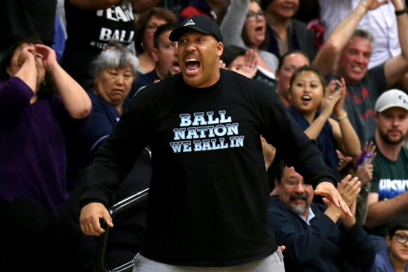 LaVar Ball cheers during a game in 2015 when all three of his sons played together at Chino Hills High.