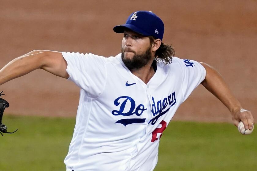 Los Angeles Dodgers starting pitcher Clayton Kershaw throws to the Milwaukee Brewers in Game 2 of a National League wild-card baseball series Thursday, Oct. 1, 2020, in Los Angeles. (AP Photo/Ashley Landis)