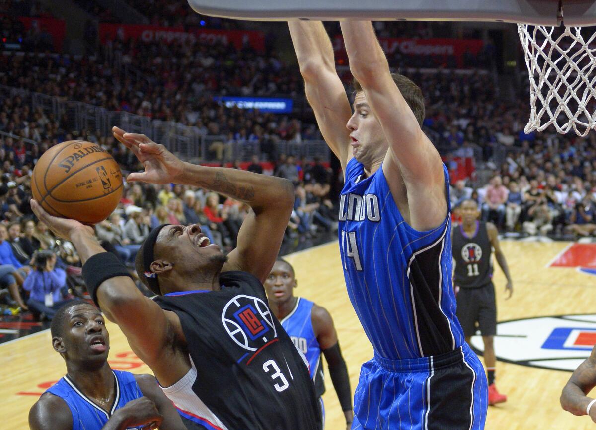 Clippers forward Paul Pierce shoots as Orlando Magic forward Jason Smith, right, defends during the second half of a game on Dec. 5 at Staples Center.