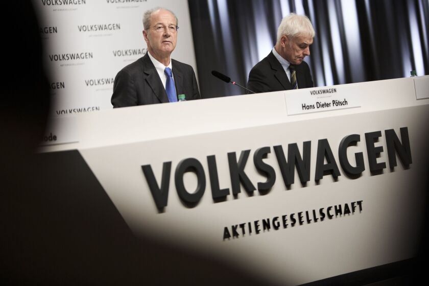 Hans Dieter Poetsch, left, chairman of the Supervisory Board of Volkswagen AG, and Volkswagen Group Chairman Matthias Mueller give an update on the VW emissions scandal.
