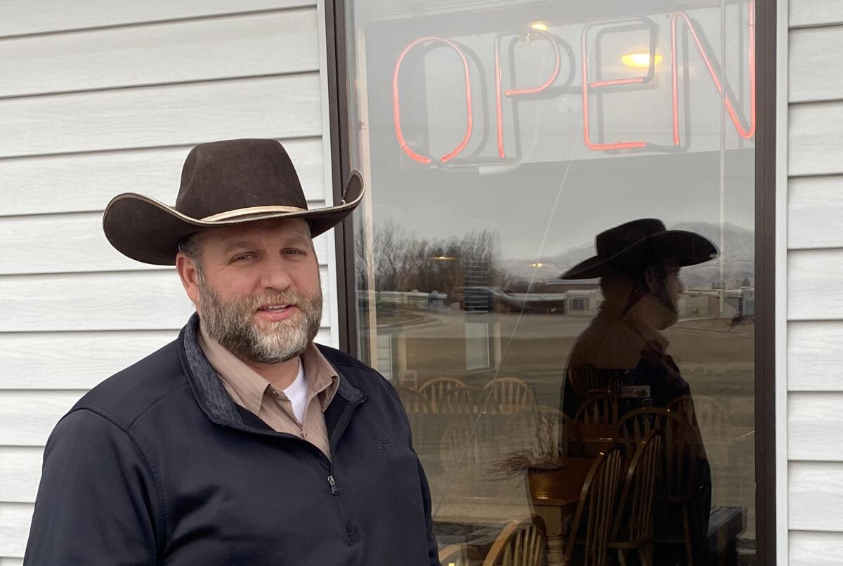 Ammon Bundy stands in front of a restaurant in Emmett, Idaho, on Jan. 27, 2021.